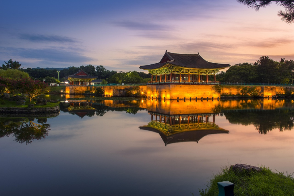 Donggung Palace and Wolji Pond illuminated at night with reflections on the water in Gyeongju