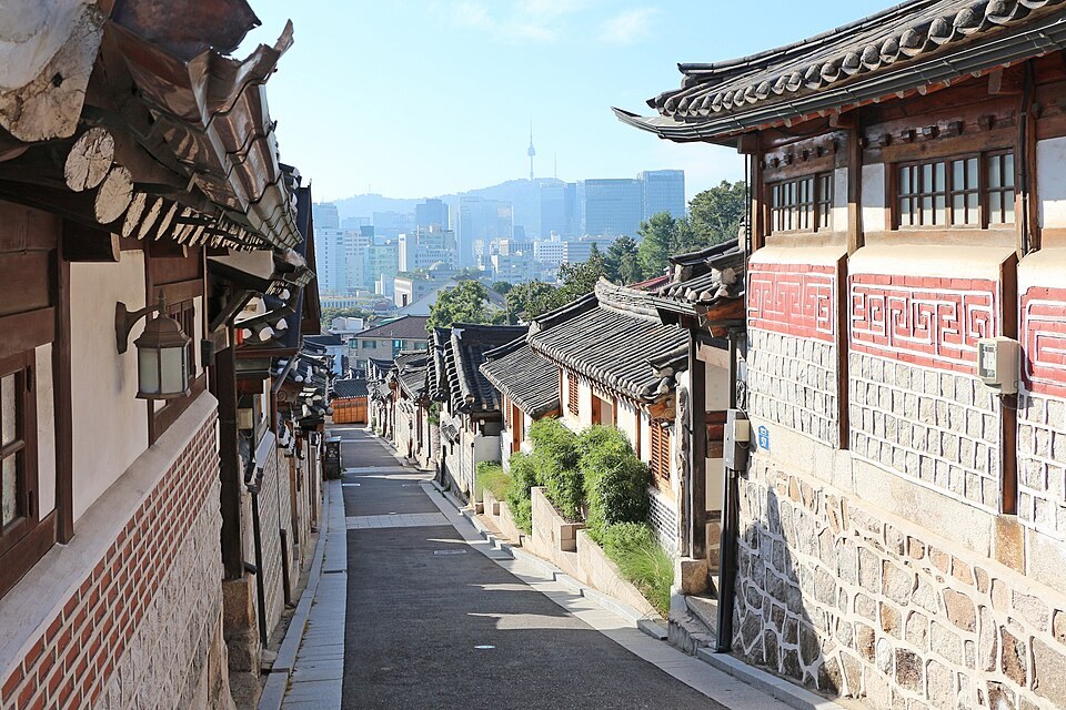 Traditional Korean houses in Bukchon Hanok Village with Namsan Seoul Tower in the background, Seoul