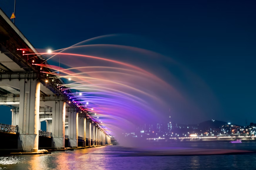 Banpo Bridge Rainbow Fountain show at night over the Han River in Seoul, South Korea