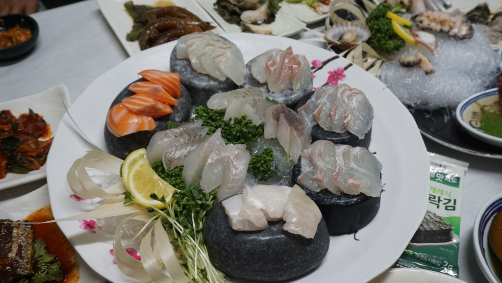 Korean sashimi platter with assorted raw fish and squid, a popular seafood dish from the East Sea