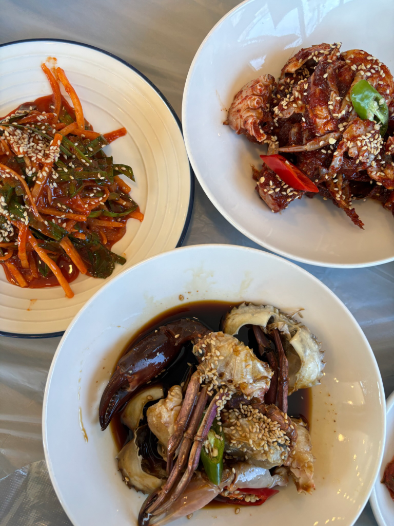 Korean soy sauce marinated crab (Ganjang Gejang) served with side dishes, a specialty of the West Sea